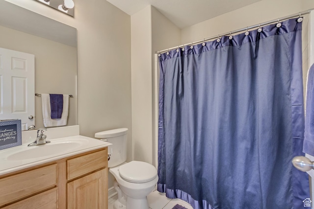 full bath with curtained shower, vanity, tile patterned flooring, and toilet