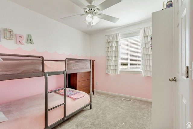 unfurnished bedroom featuring visible vents, baseboards, a ceiling fan, and carpet flooring