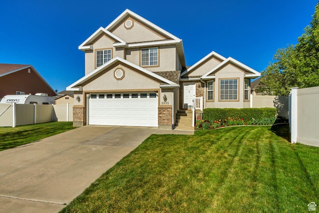 view of front of property with fence, concrete driveway, a front yard, and stucco siding