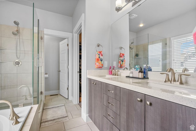 5131 N Stratford Dr W, Stansbury Park, UT 84074 - full bath featuring tile patterned floors, a sink, double vanity, and a stall shower