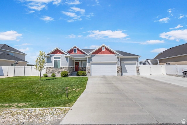 5131 N Stratford Dr W, Stansbury Park, UT 84074 - craftsman-style home featuring stone siding, an attached garage, board and batten siding, and concrete driveway
