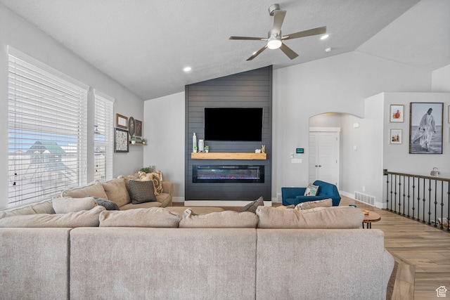 5131 N Stratford Dr W, Stansbury Park, UT 84074 - living room with ceiling fan, lofted ceiling, wood finished floors, and a fireplace