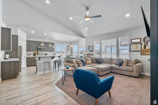 5131 N Stratford Dr W, Stansbury Park, UT 84074 - living room featuring ceiling fan, light wood-style floors, a textured ceiling, and recessed lighting