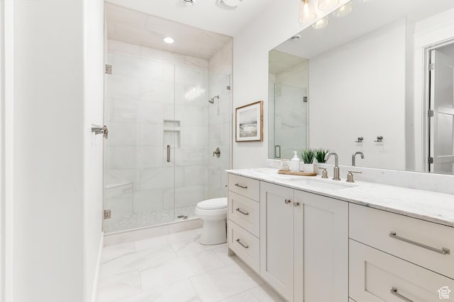 full bath featuring vanity, toilet, marble finish floor, and a stall shower