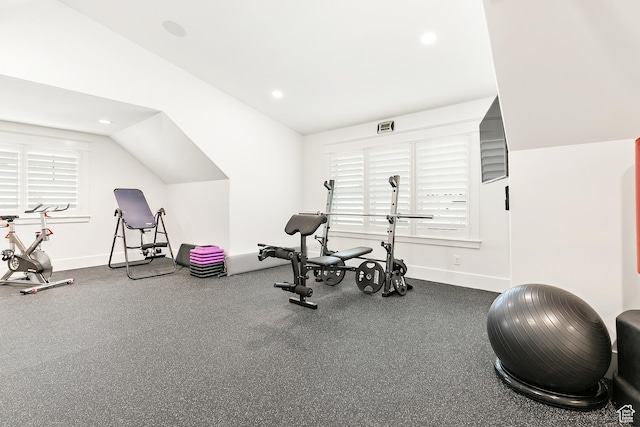 workout area featuring recessed lighting, baseboards, and lofted ceiling