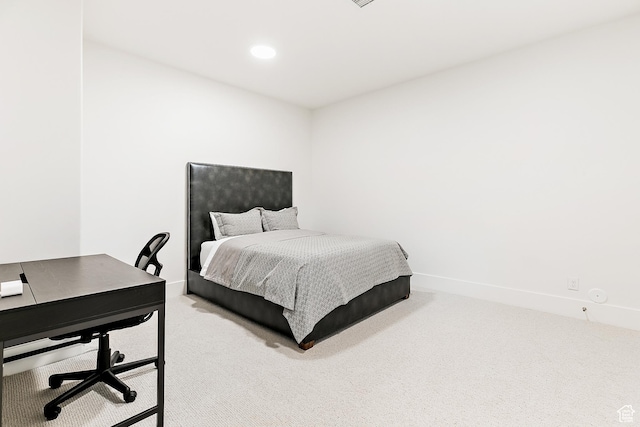 bedroom with recessed lighting, baseboards, and carpet floors