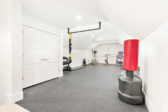 workout room featuring lofted ceiling, recessed lighting, and baseboards
