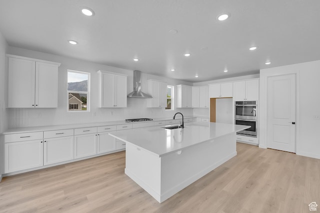 1811 N 375 W Unit 8, Harrisville, UT 84404 - kitchen with stainless steel appliances, wall chimney range hood, white cabinetry, tasteful backsplash, and recessed lighting
