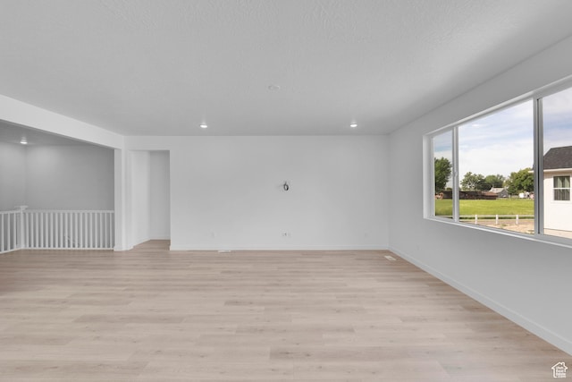 1811 N 375 W Unit 8, Harrisville, UT 84404 - spare room with light wood-style flooring and recessed lighting