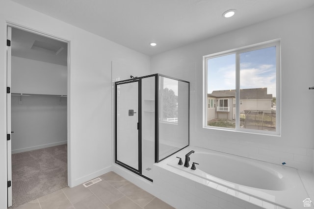 1811 N 375 W Unit 8, Harrisville, UT 84404 - full bathroom with a stall shower, a garden tub, a walk in closet, recessed lighting, and tile patterned flooring
