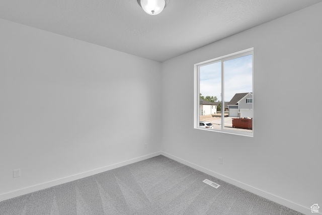 1811 N 375 W Unit 8, Harrisville, UT 84404 - carpeted spare room featuring baseboards and a textured ceiling