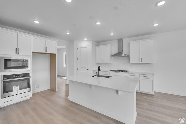 406 W 1225 N Unit 4, Harrisville, UT 84404 - kitchen with wall chimney range hood, appliances with stainless steel finishes, recessed lighting, white cabinets, and light countertops