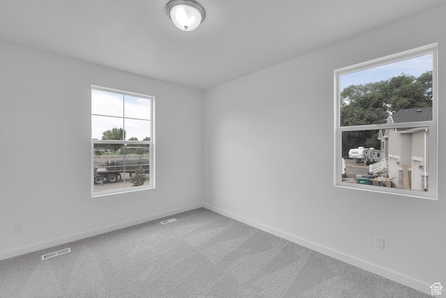 406 W 1225 N Unit 4, Harrisville, UT 84404 - empty room with healthy amount of natural light and carpet