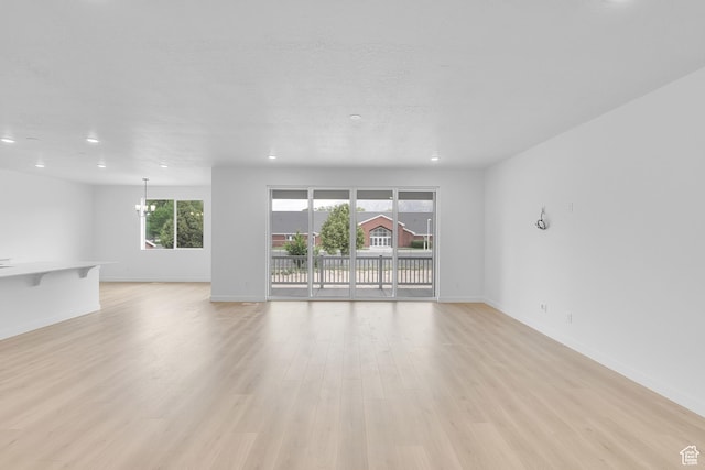406 W 1225 N Unit 4, Harrisville, UT 84404 - unfurnished living room featuring a chandelier, recessed lighting, and light wood finished floors