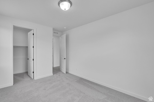 406 W 1225 N Unit 4, Harrisville, UT 84404 - unfurnished bedroom with carpet flooring, a walk in closet, and a closet