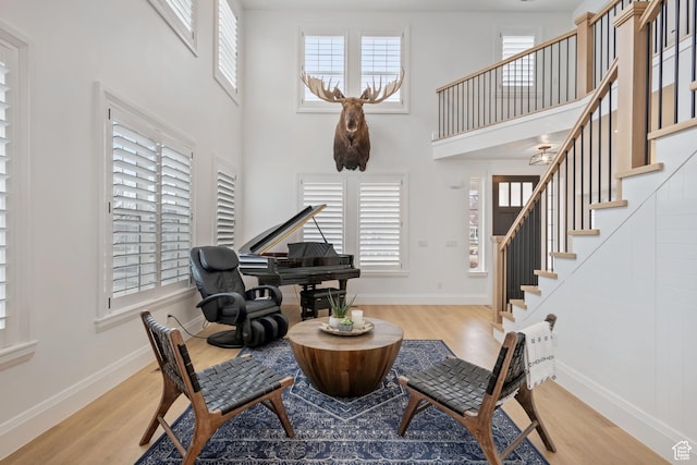 238 W Founders Blvd, Saratoga Springs, UT 84045 - living area with a high ceiling, stairs, baseboards, and wood finished floors