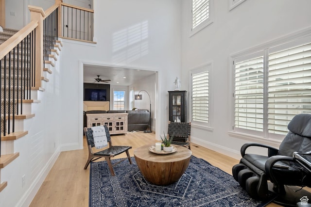 238 W Founders Blvd, Saratoga Springs, UT 84045 - sitting room featuring a healthy amount of sunlight, stairs, a ceiling fan, and wood finished floors