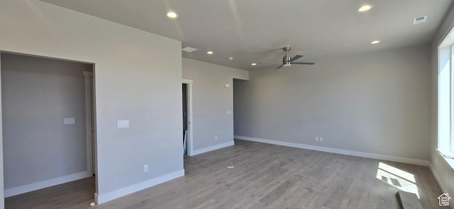 empty room with light wood-style floors, visible vents, ceiling fan, and recessed lighting