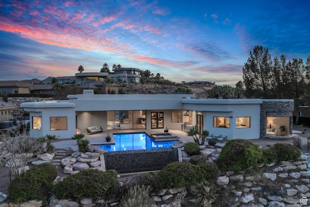 2031 E Cliff Point Dr, St George, UT 84790 - rear view of property featuring an in ground hot tub, a patio area, and stucco siding