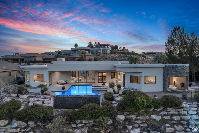 2031 E Cliff Point Dr, St George, UT 84790 - back of property featuring an outdoor living space, stucco siding, a patio, and an outdoor pool
