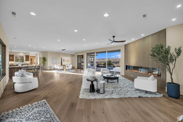2031 E Cliff Point Dr, St George, UT 84790 - living area with visible vents, recessed lighting, a fireplace, and wood finished floors