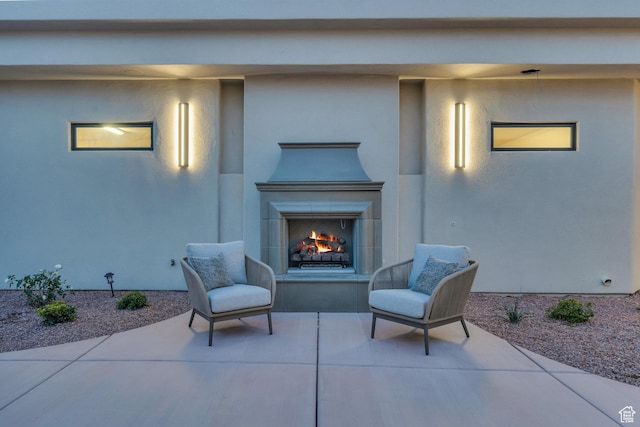 2031 E Cliff Point Dr, St George, UT 84790 - view of patio / terrace with a lit fireplace