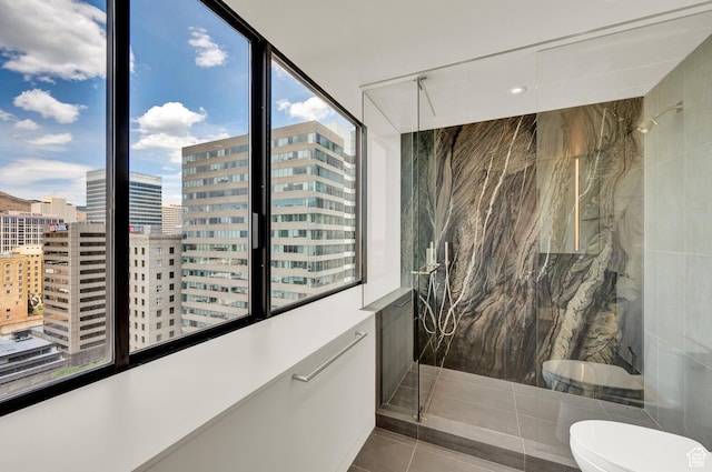 48 W 300 S Unit 2204-N, Salt Lake City, UT 84101 - full bathroom with tile patterned flooring, a view of city, toilet, and a marble finish shower