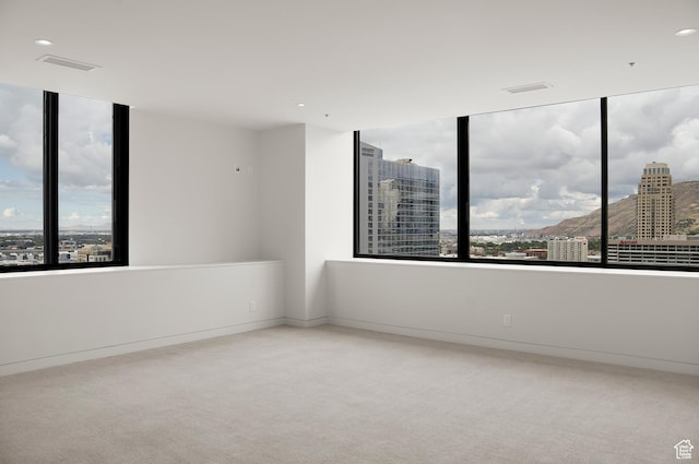 48 W 300 S Unit 2204-N, Salt Lake City, UT 84101 - unfurnished room featuring visible vents, a view of city, carpet, and baseboards