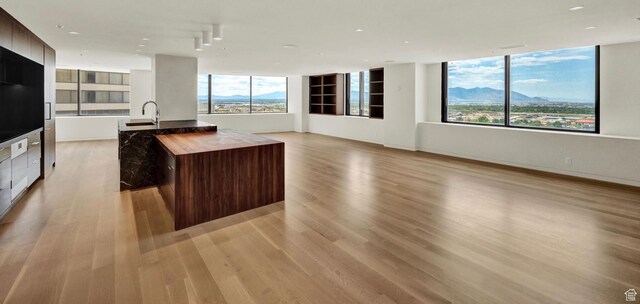 48 W 300 S Unit 2204-N, Salt Lake City, UT 84101 - kitchen featuring modern cabinets, a center island with sink, light wood finished floors, and a sink