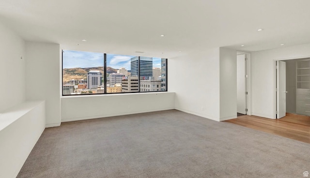 48 W 300 S Unit 2204-N, Salt Lake City, UT 84101 - carpeted spare room with a city view and recessed lighting