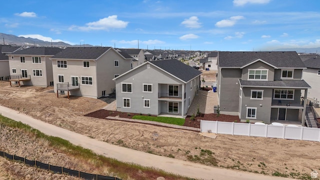 6311 W Butte County Dr S Unit 448, Herriman, UT 84096 - view of front of house with a residential view, a mountain view, and stucco siding