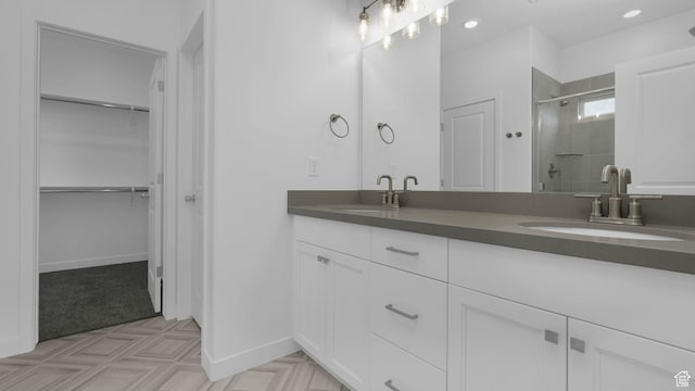 6311 W Butte County Dr S Unit 448, Herriman, UT 84096 - full bathroom featuring double vanity, a shower stall, a spacious closet, and baseboards