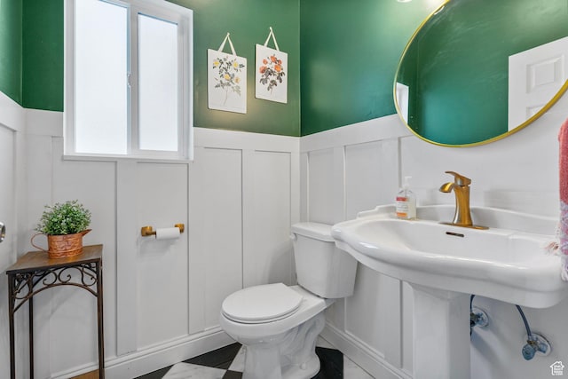 13105 S 2420 W, Riverton, UT 84065 - half bath with a decorative wall, wainscoting, and toilet