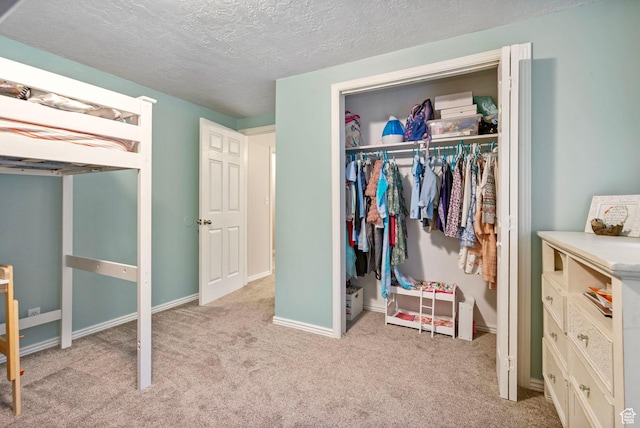 13105 S 2420 W, Riverton, UT 84065 - carpeted bedroom with a closet, a textured ceiling, and baseboards