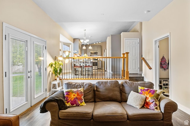 13105 S 2420 W, Riverton, UT 84065 - living area featuring wood finished floors, a chandelier, and baseboards