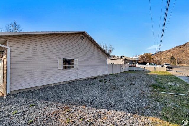 77 E 1100 N, Pleasant Grove, UT 84062 - view of side of home with a mountain view and fence