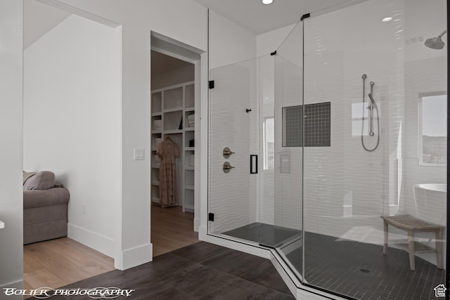 3218 E Rimrunner Dr, St George, UT 84790 - full bathroom with wood finished floors, a stall shower, and baseboards