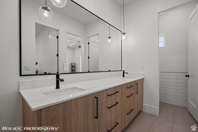 3218 E Rimrunner Dr, St George, UT 84790 - full bathroom featuring a ceiling fan, tile patterned floors, double vanity, and a sink