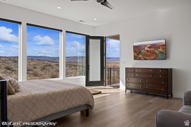 3218 E Rimrunner Dr, St George, UT 84790 - bedroom with visible vents, recessed lighting, wood finished floors, a ceiling fan, and access to outside