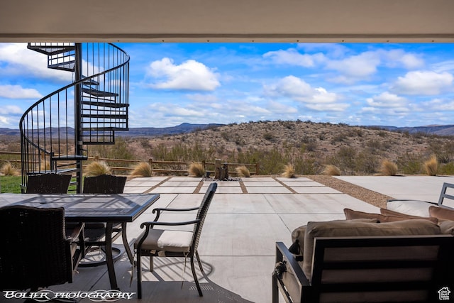3218 E Rimrunner Dr, St George, UT 84790 - view of patio featuring a mountain view, outdoor dining area, and stairs