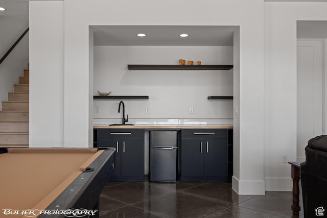 3218 E Rimrunner Dr, St George, UT 84790 - bar with a sink, freestanding refrigerator, recessed lighting, wet bar, and stairs