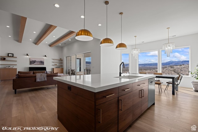 3218 E Rimrunner Dr, St George, UT 84790 - kitchen with light wood finished floors, a sink, beamed ceiling, modern cabinets, and a chandelier