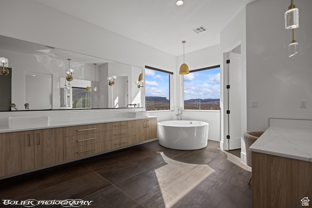 3218 E Rimrunner Dr, St George, UT 84790 - full bath with double vanity, visible vents, and a soaking tub