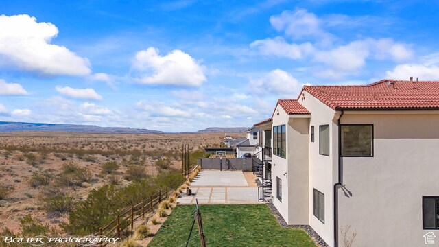 3218 E Rimrunner Dr, St George, UT 84790 - view of yard featuring a patio, fence, and a mountain view