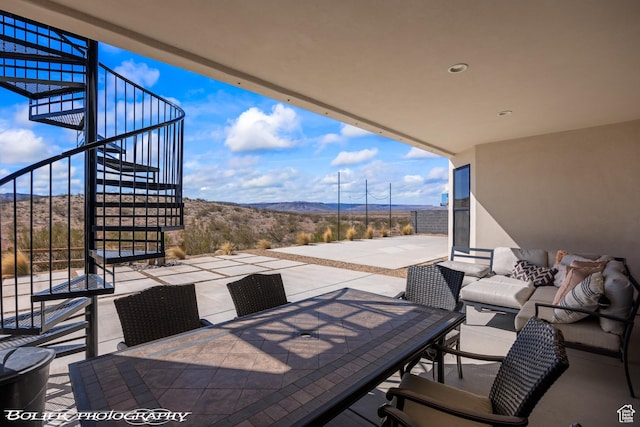 3218 E Rimrunner Dr, St George, UT 84790 - view of patio featuring outdoor dining space, stairs, a mountain view, and an outdoor hangout area