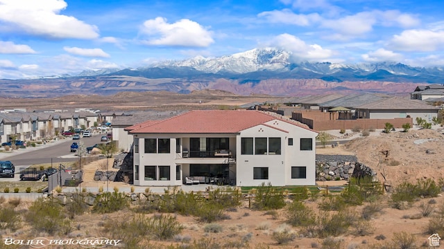 3218 E Rimrunner Dr, St George, UT 84790 - exterior space with fence, a residential view, a tile roof, stucco siding, and a mountain view