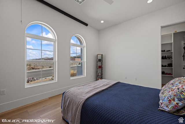 3218 E Rimrunner Dr, St George, UT 84790 - bedroom featuring visible vents, light wood-style flooring, recessed lighting, and baseboards