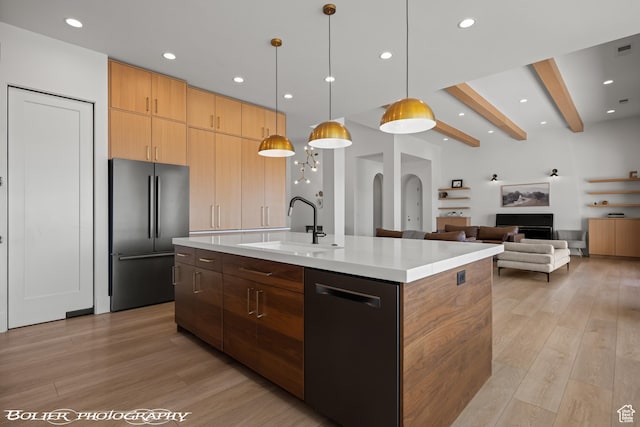 3218 E Rimrunner Dr, St George, UT 84790 - kitchen featuring modern cabinets, a sink, freestanding refrigerator, light wood finished floors, and dishwasher