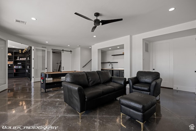 3218 E Rimrunner Dr, St George, UT 84790 - living room with a barn door, recessed lighting, a ceiling fan, and visible vents