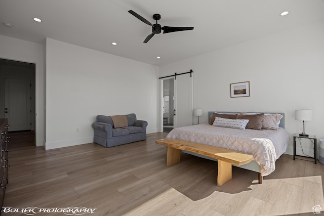 3218 E Rimrunner Dr, St George, UT 84790 - bedroom with a ceiling fan, wood finished floors, baseboards, recessed lighting, and a barn door